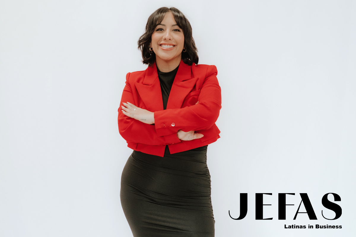 Founder, Boss Babe pop-up Fabi Plasencia smiles at camera wearing red jacket over Black dress